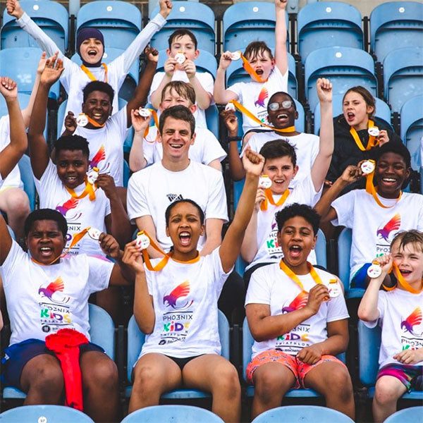 Jonny Brownlee celebrates with the participants of the Brownlee Foundation event